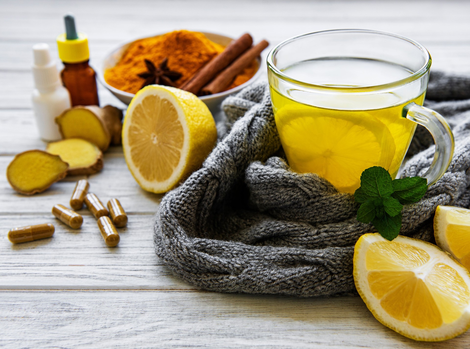 Natural healthy turmeric drink instead of traditional drugs and pills against flu. Alternative medicine concept.