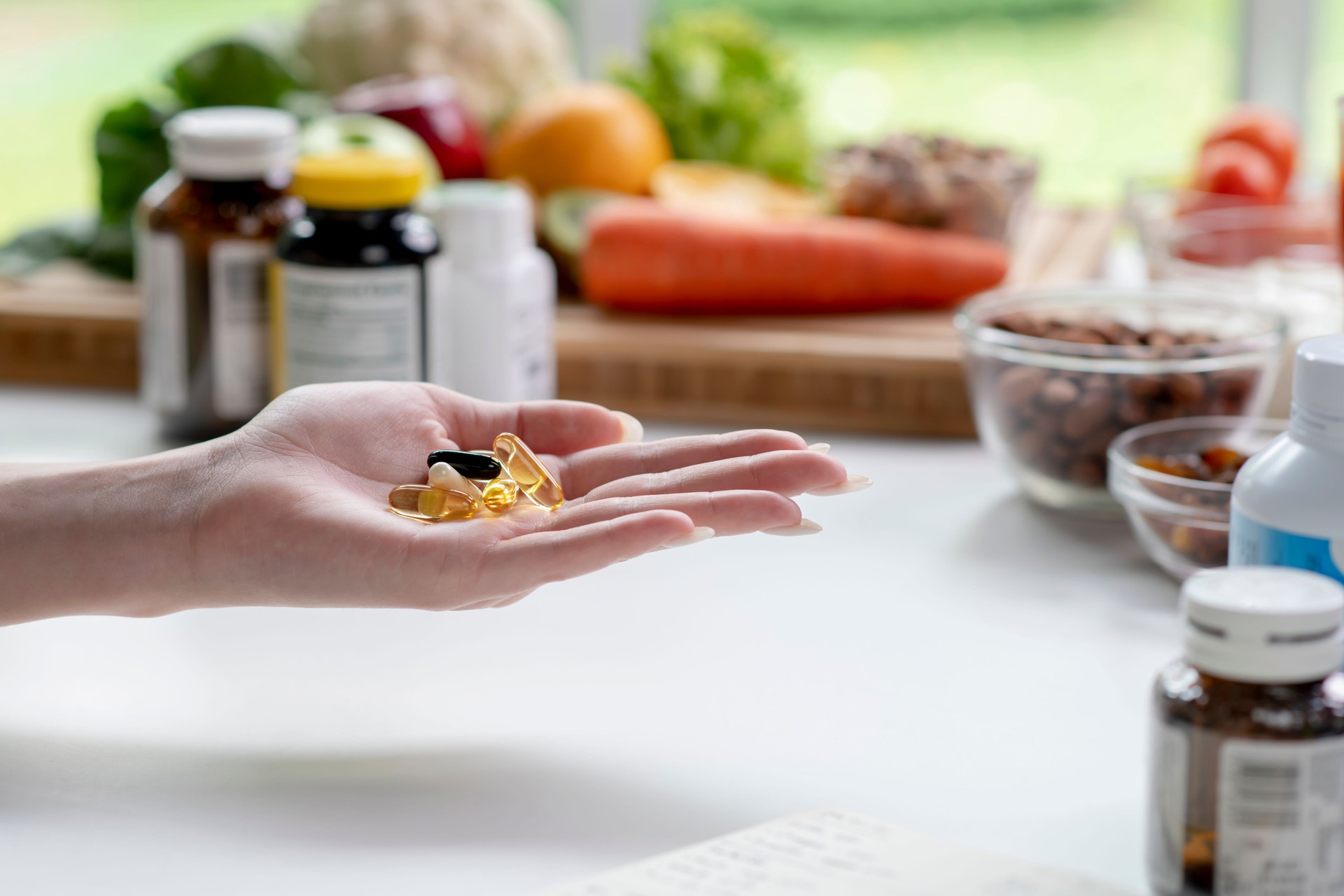 Nutritionist checking dietary supplements in hand